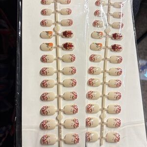 Two (2) Sets of Press on Nails Medium length